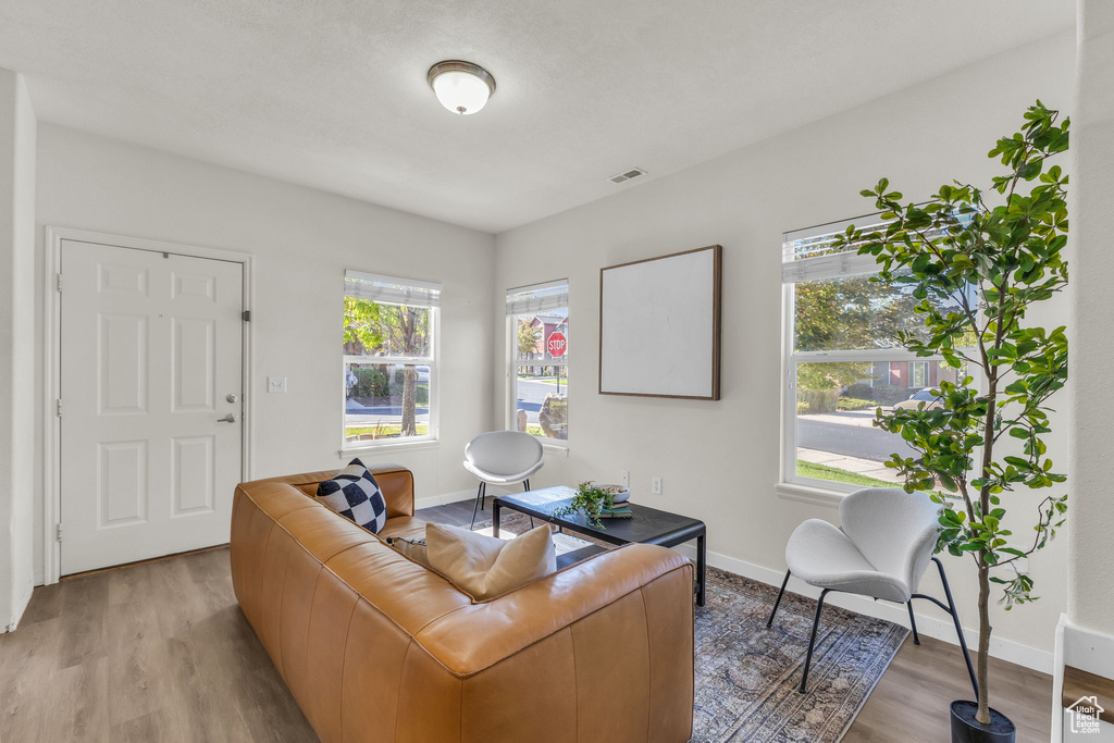 Living room with light wood-type flooring