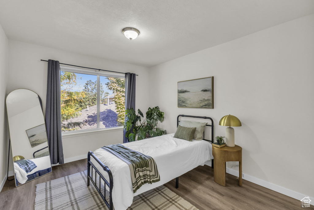 Bedroom featuring dark hardwood / wood-style flooring