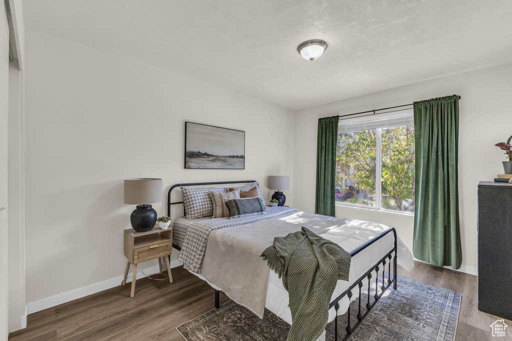 Bedroom featuring wood-type flooring