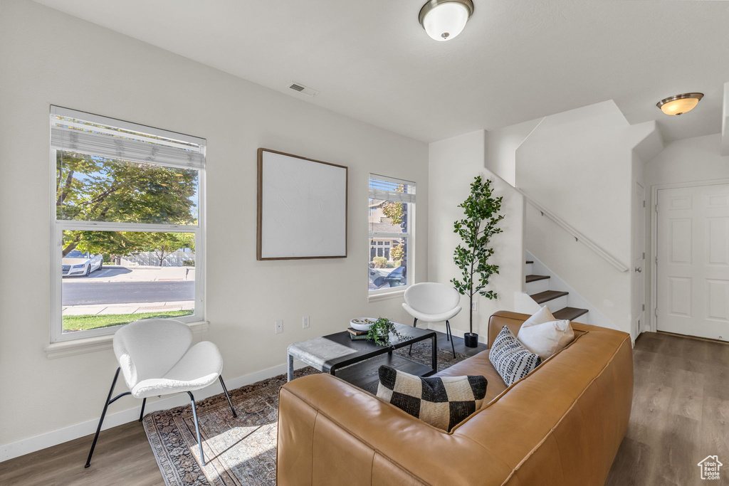 Living room with wood-type flooring and plenty of natural light