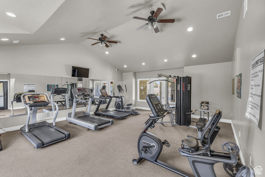 Exercise room with high vaulted ceiling and ceiling fan