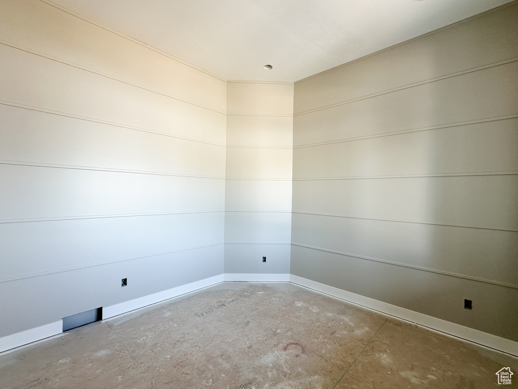 Empty room featuring concrete floors