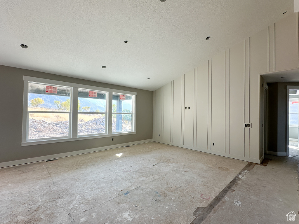 Empty room with a textured ceiling