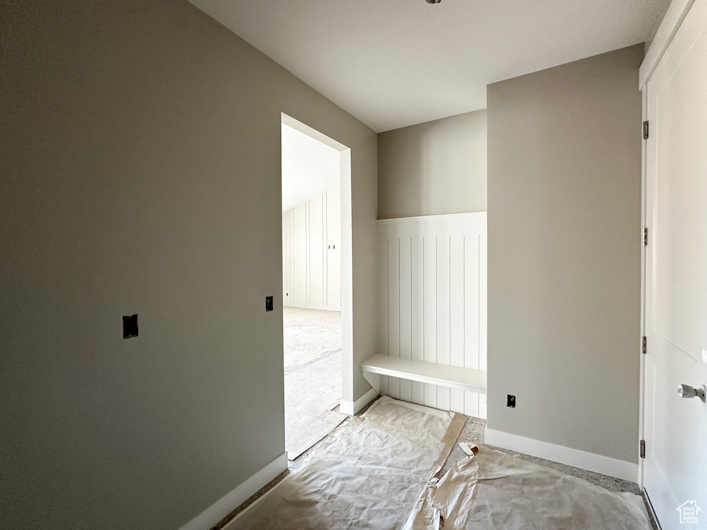 Mudroom featuring light carpet