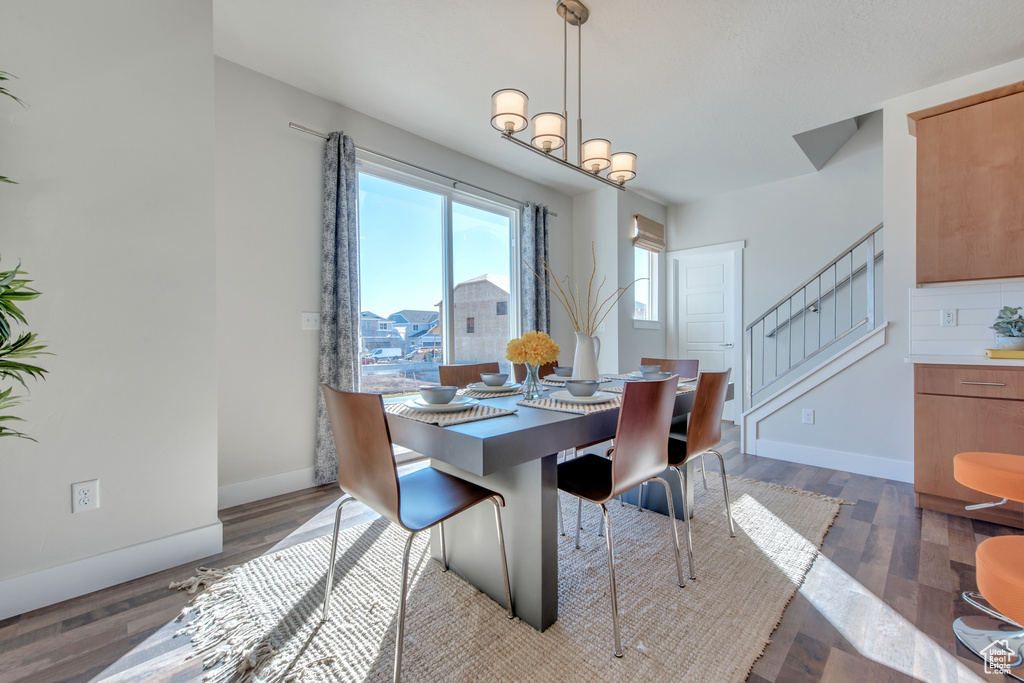 Dining room with dark wood-type flooring