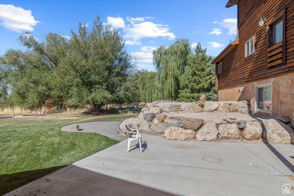 View of yard with a patio area