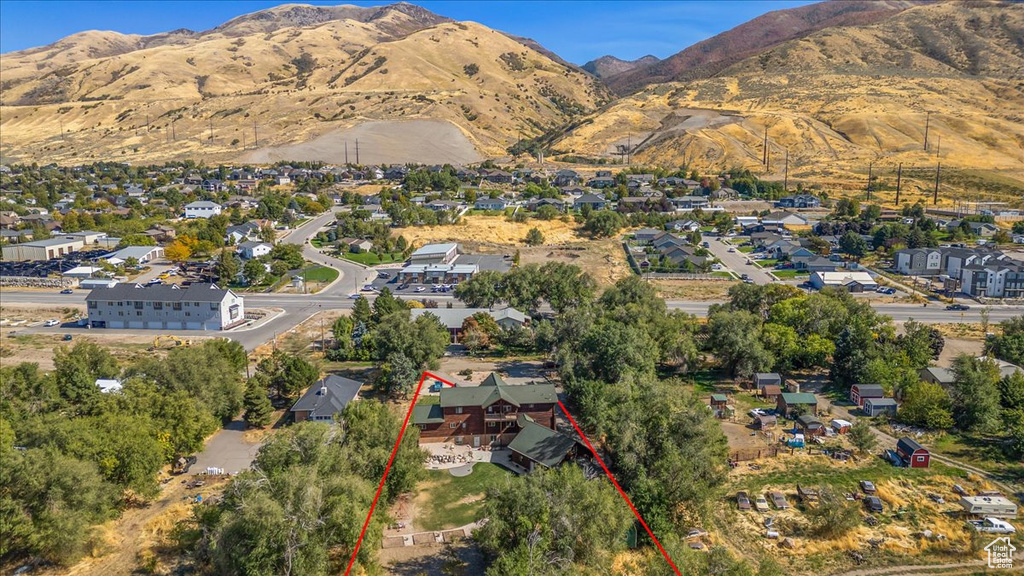 Birds eye view of property with a mountain view