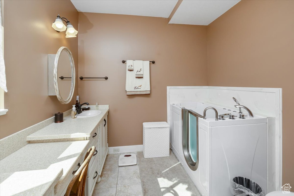 Bathroom featuring vanity and tile patterned flooring