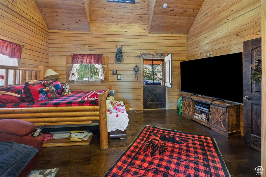 Bedroom featuring dark wood-type flooring, wooden ceiling, high vaulted ceiling, and multiple windows