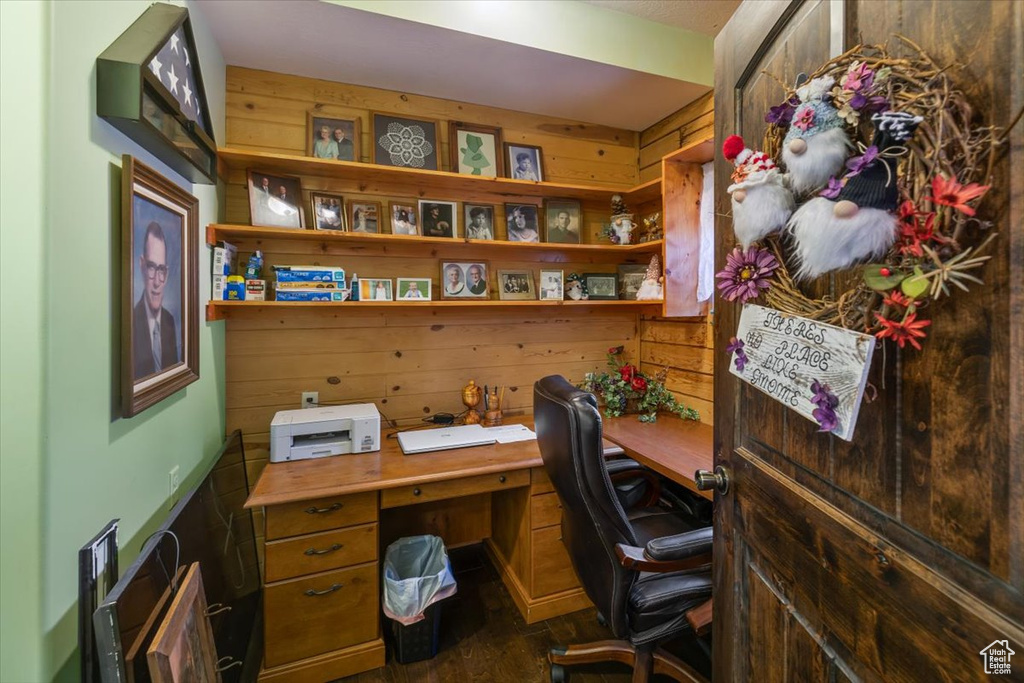 Office space featuring wooden walls