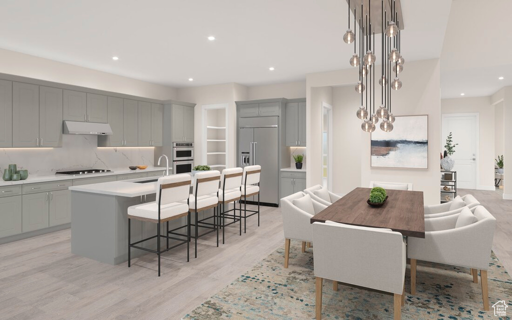 Dining room featuring light hardwood / wood-style floors and sink