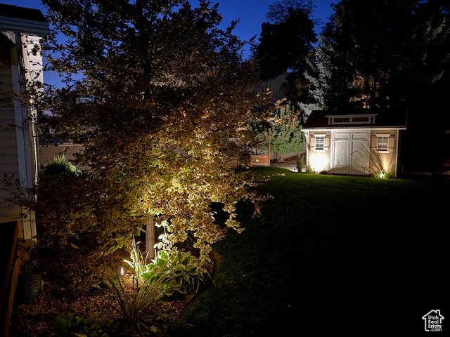 Yard at twilight with a storage shed