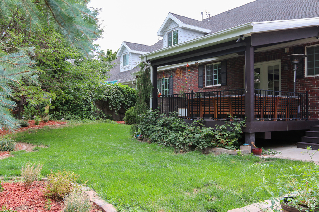 View of yard with a deck