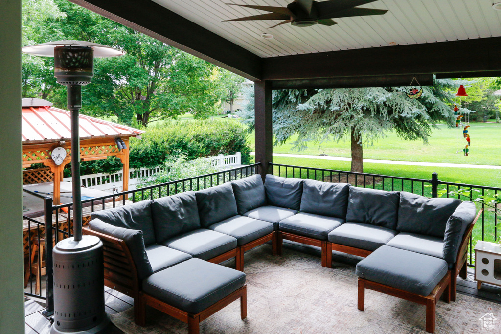 View of patio / terrace featuring a gazebo, an outdoor living space, and ceiling fan