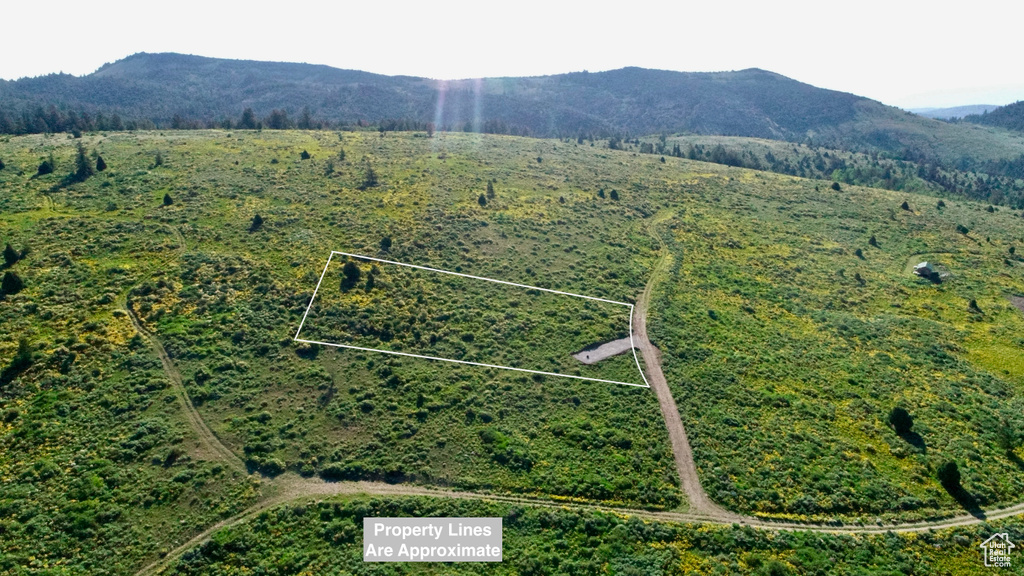 View of property location with a mountainous background and property parcel outlined