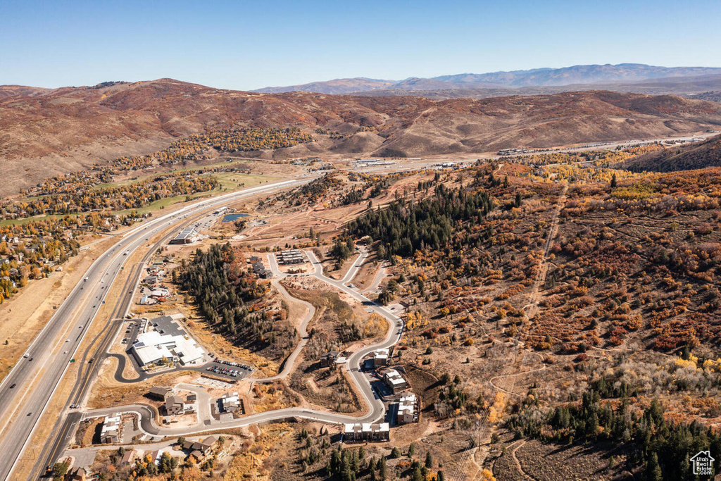 Birds eye view of property with a mountain view