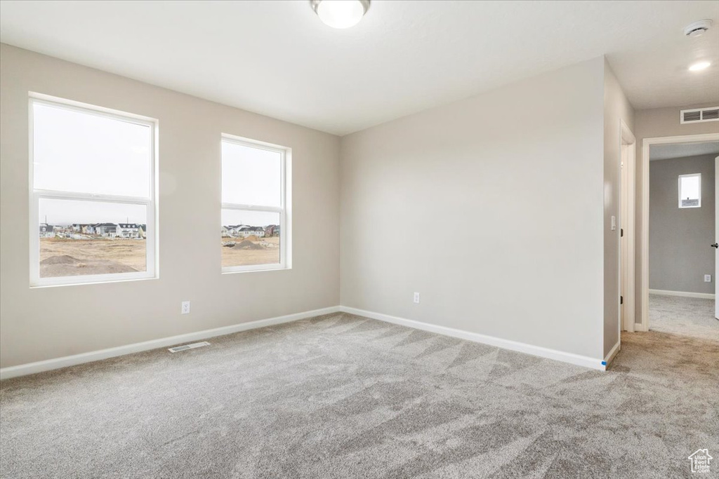 View of carpeted spare room