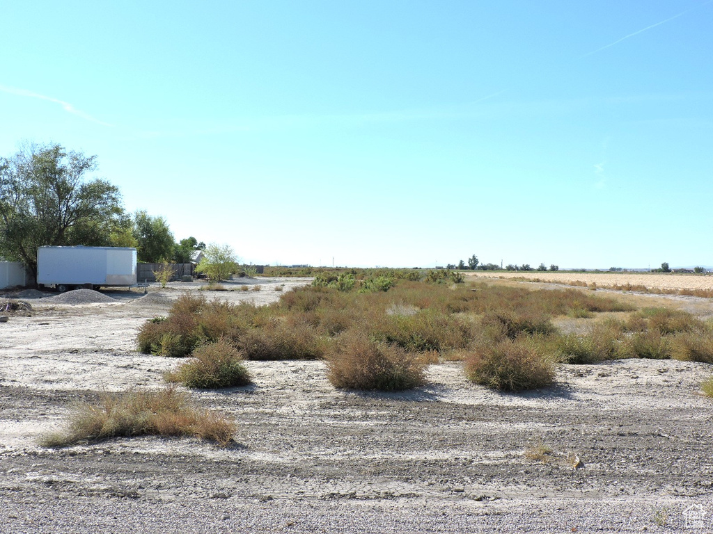 View of yard with a rural view