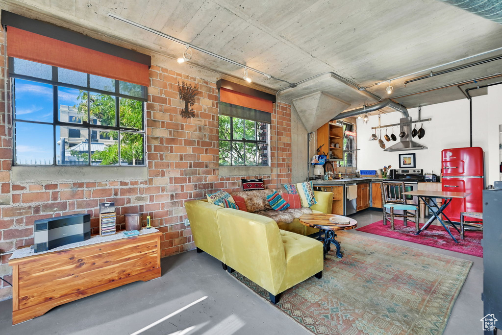 Living room with track lighting and plenty of natural light