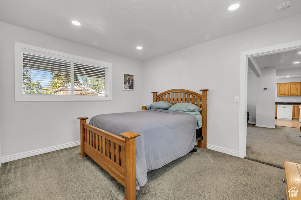 Bedroom with light carpet