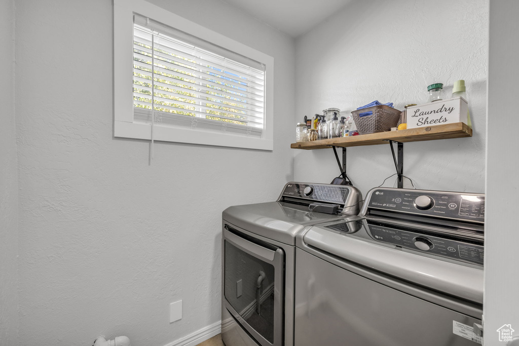 Washroom featuring independent washer and dryer