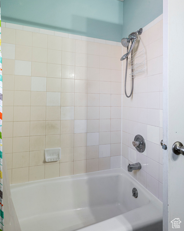 Bathroom featuring shower / bath combo with shower curtain