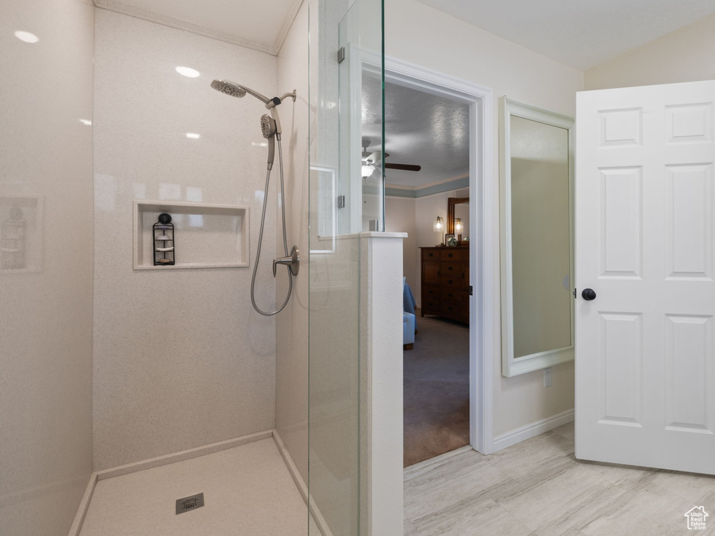 Bathroom featuring walk in shower and hardwood / wood-style floors