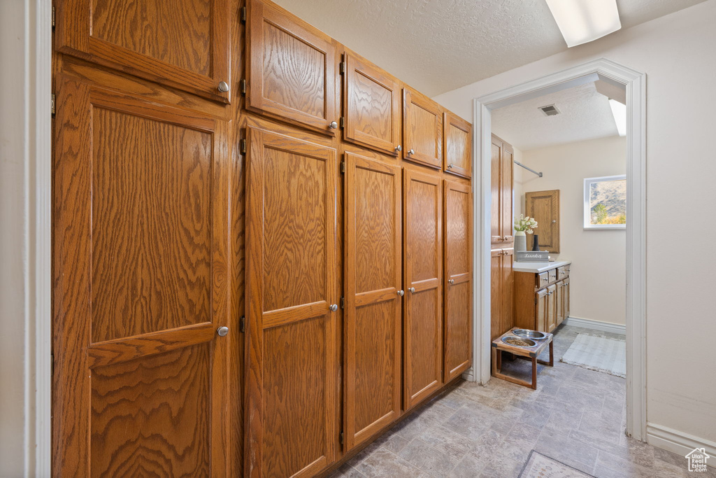 Interior space featuring a textured ceiling