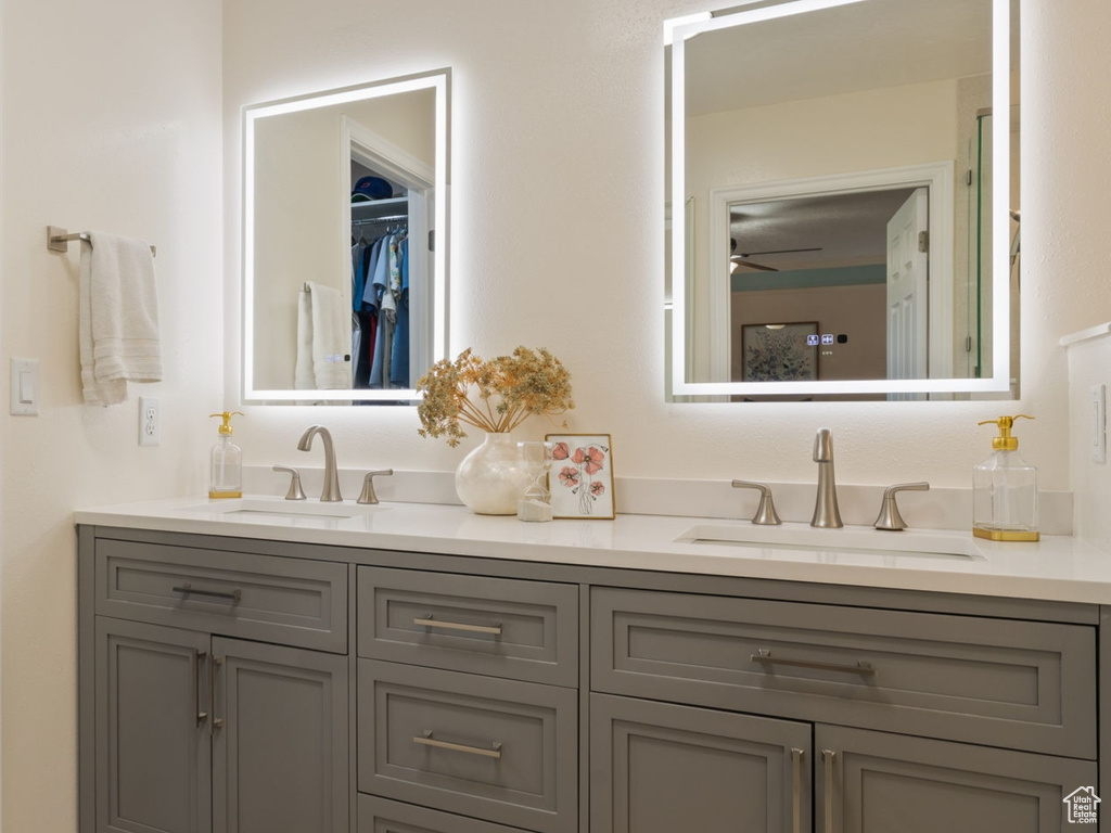 Bathroom with hardwood / wood-style flooring and vanity