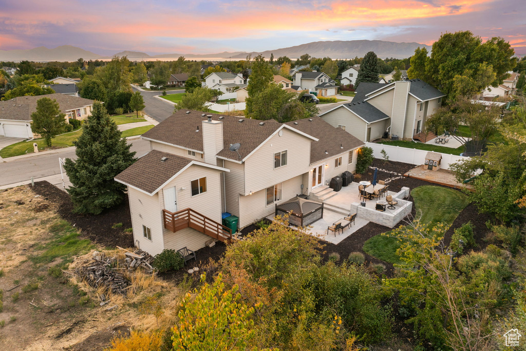 Aerial view at dusk featuring a mountain view