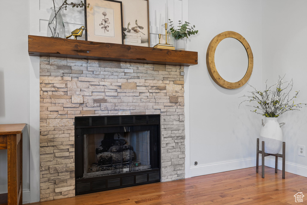 Details with a fireplace and hardwood / wood-style floors