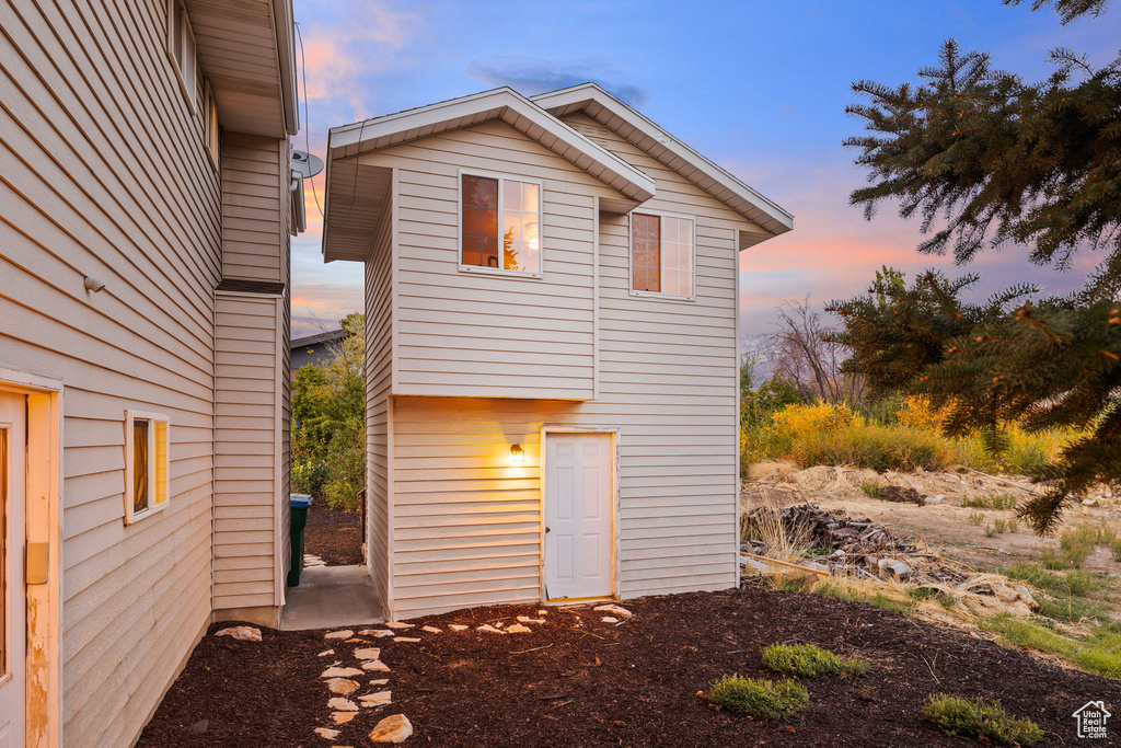 View of property exterior at dusk