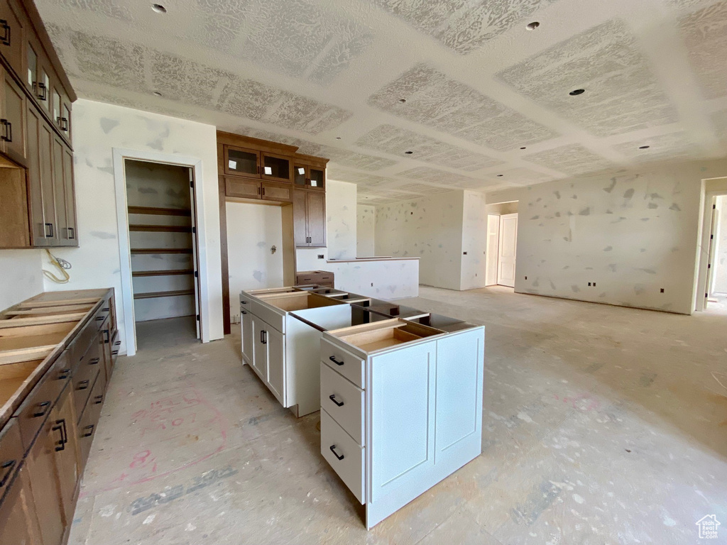 Kitchen featuring white cabinets