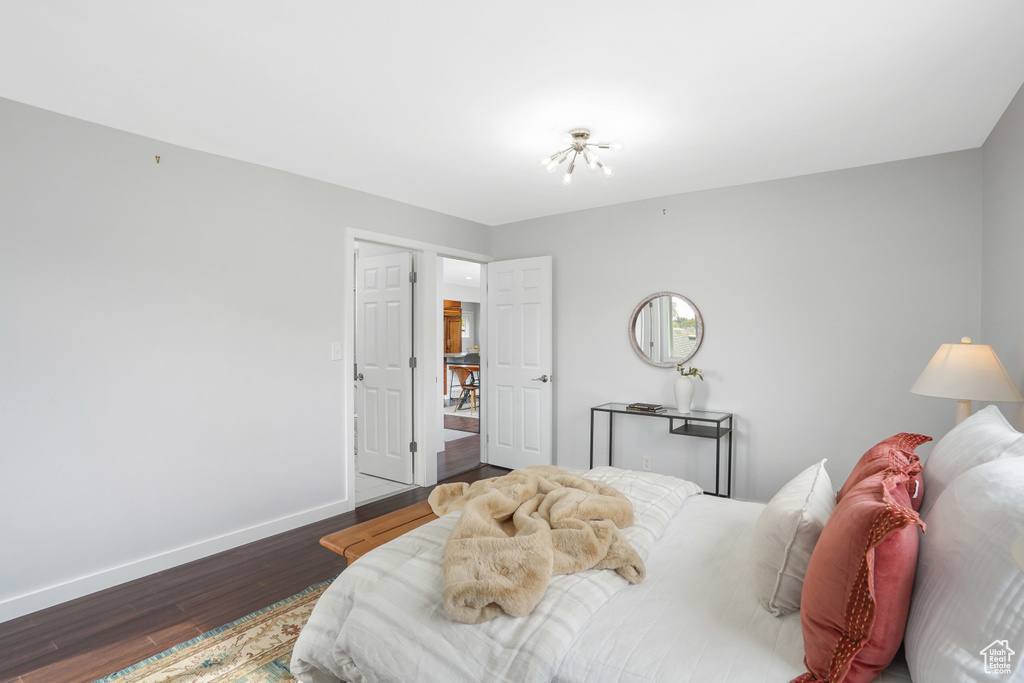 Bedroom featuring dark wood-type flooring