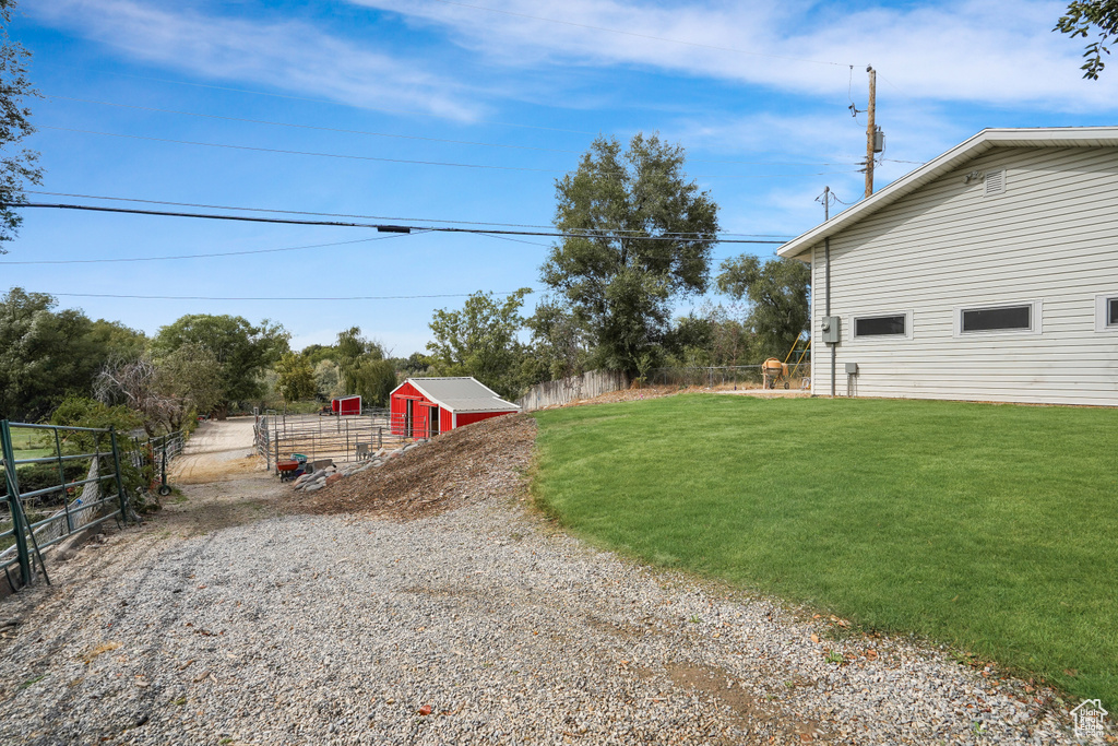 View of yard with a storage shed