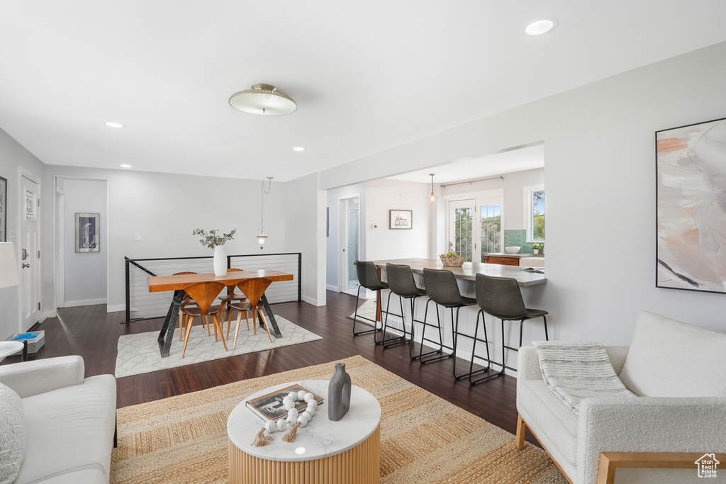 Living room with dark hardwood / wood-style flooring