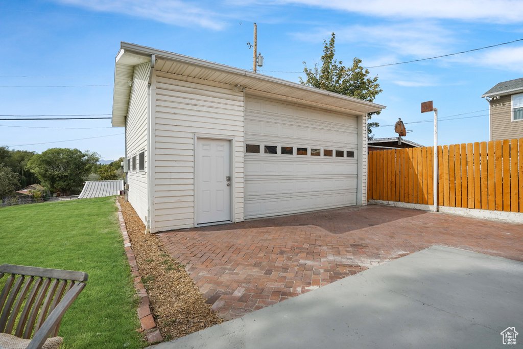 Garage featuring a yard