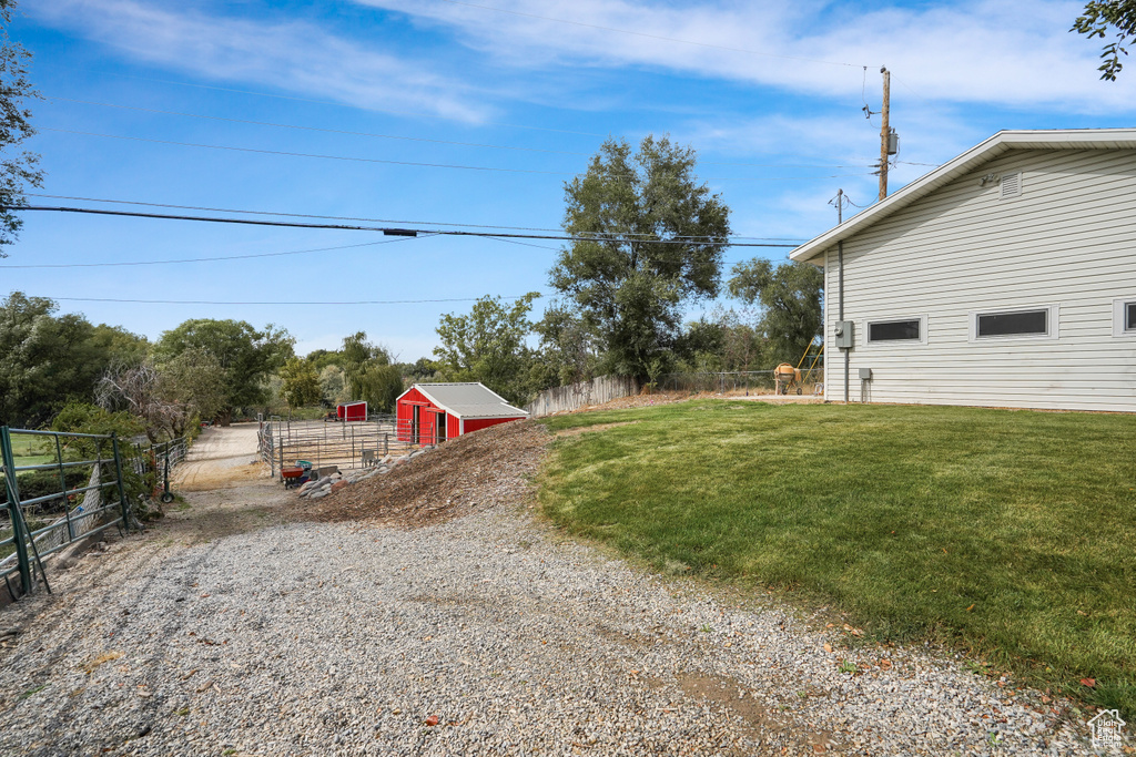 View of yard with a storage shed