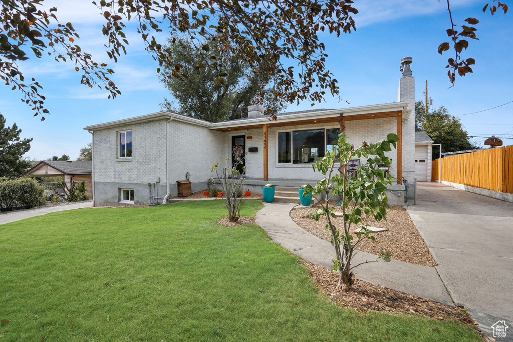 View of front of house with a front yard