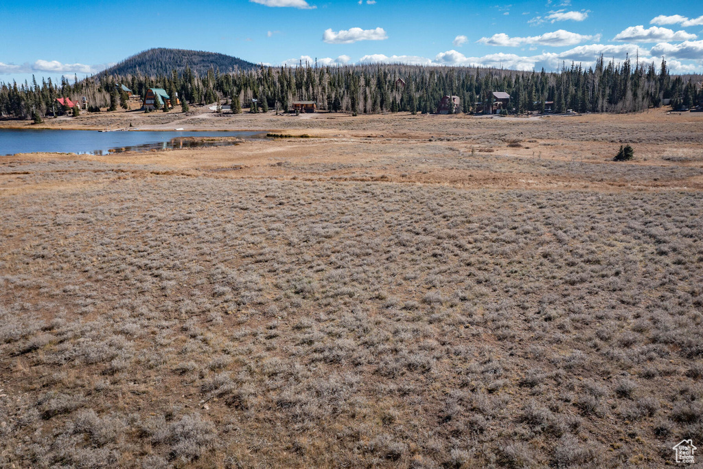 Property view of mountains with a water view