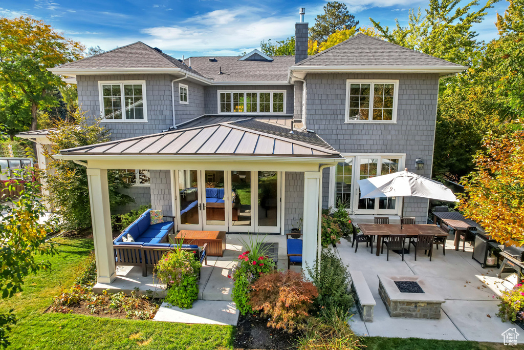 Back of property with a gazebo and a patio area