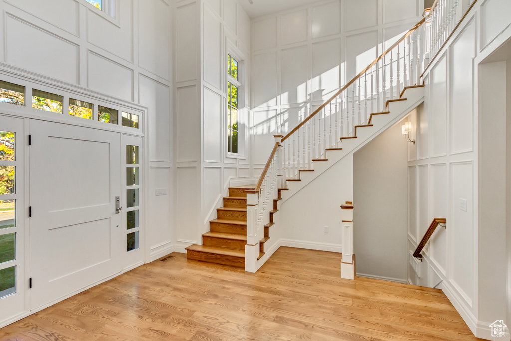 Foyer entrance with light hardwood / wood-style floors