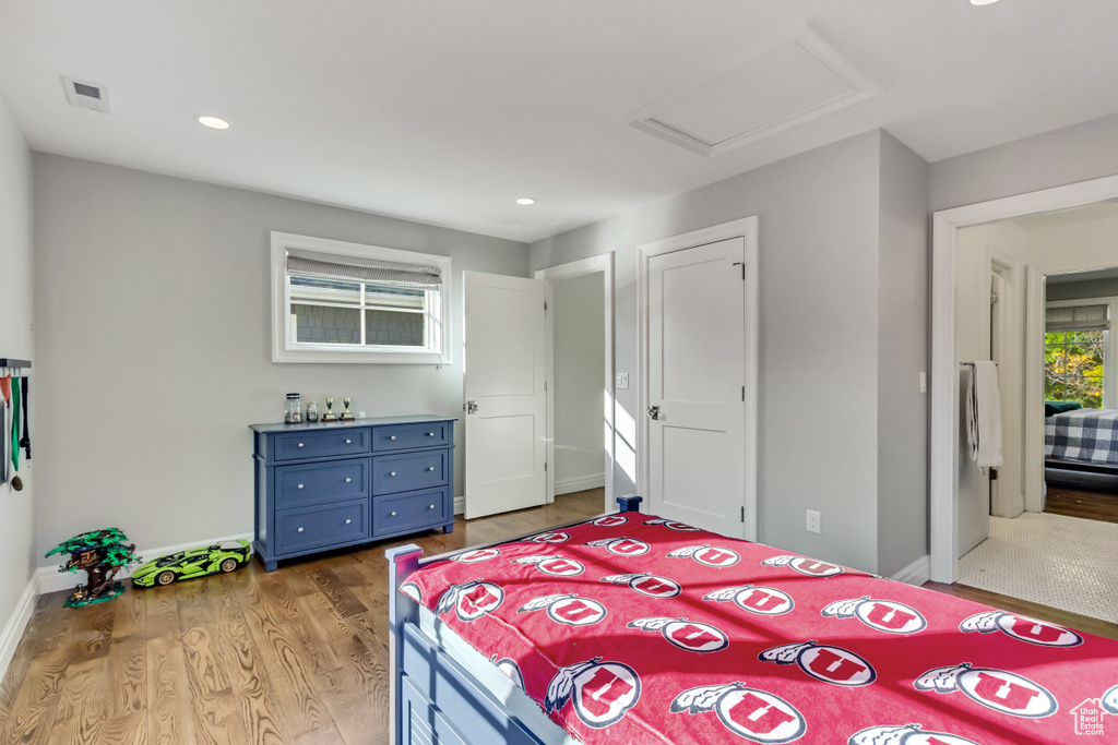 Bedroom featuring wood-type flooring