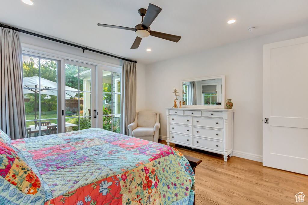 Bedroom with access to exterior, ceiling fan, and light wood-type flooring