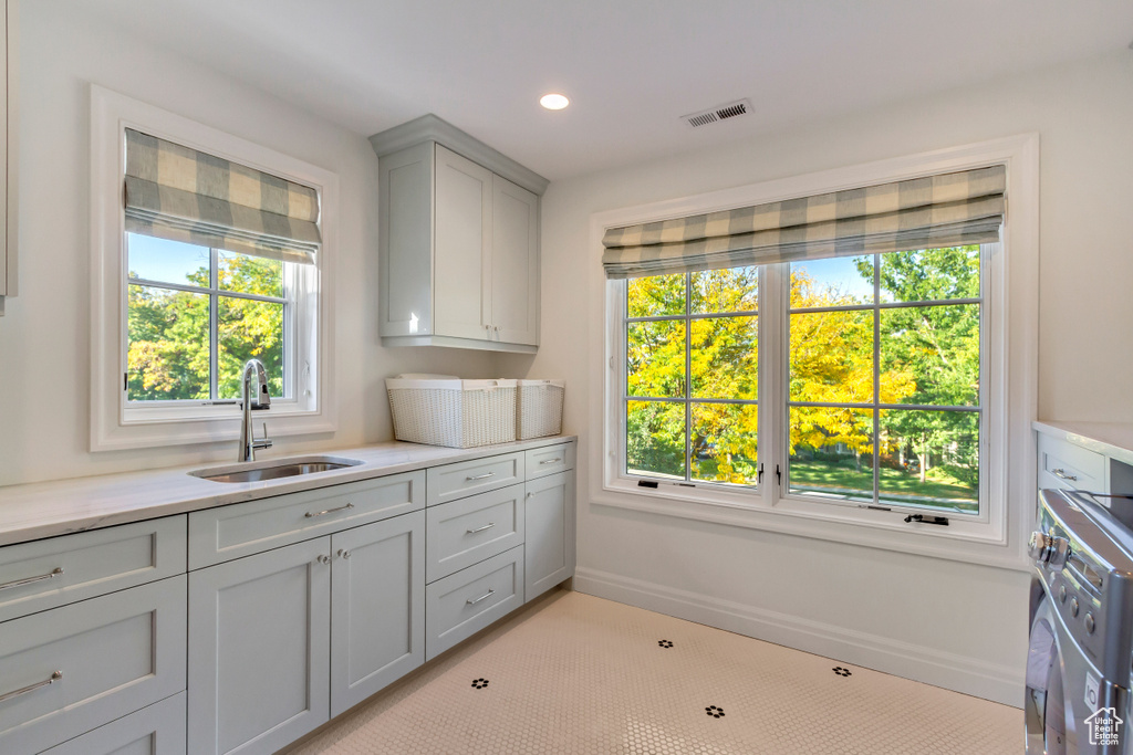 Laundry room with plenty of natural light and sink