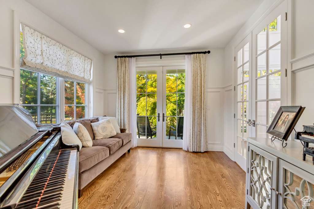 Interior space featuring french doors and light hardwood / wood-style flooring