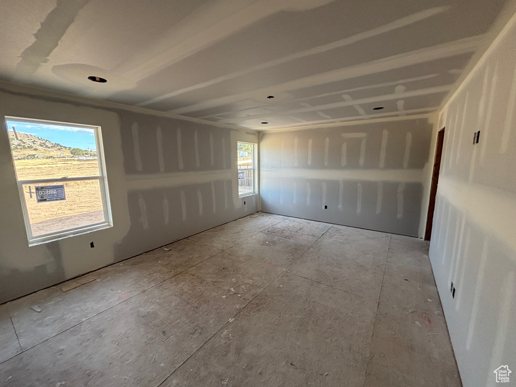 Spare room featuring a healthy amount of sunlight