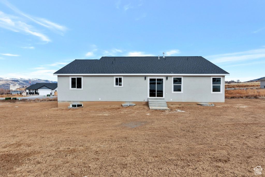 Back of property featuring a mountain view