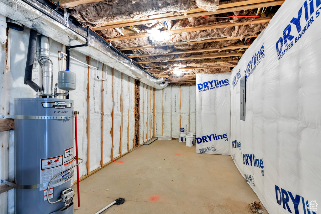 Basement featuring water heater