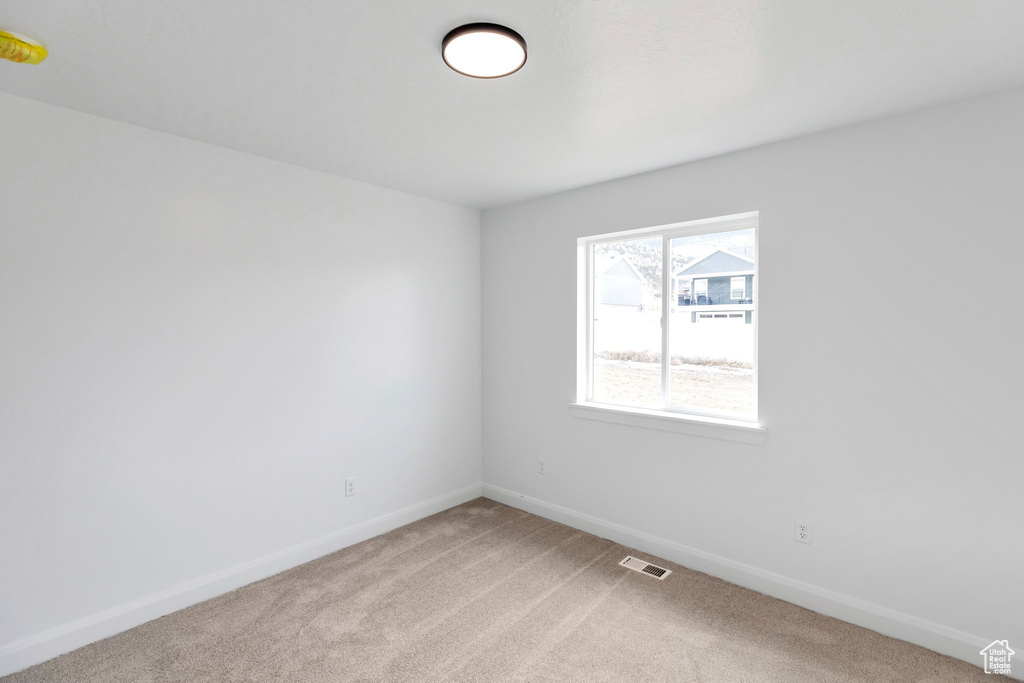 View of carpeted spare room